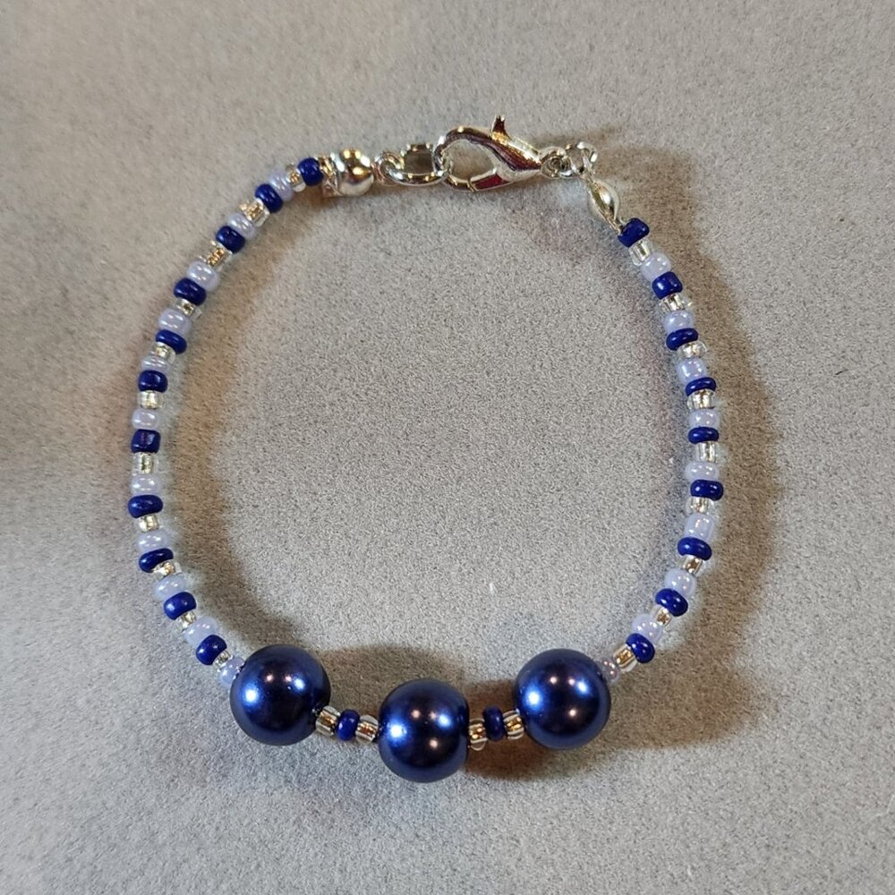 Beautiful navy blue, light blue and white beaded bracelet